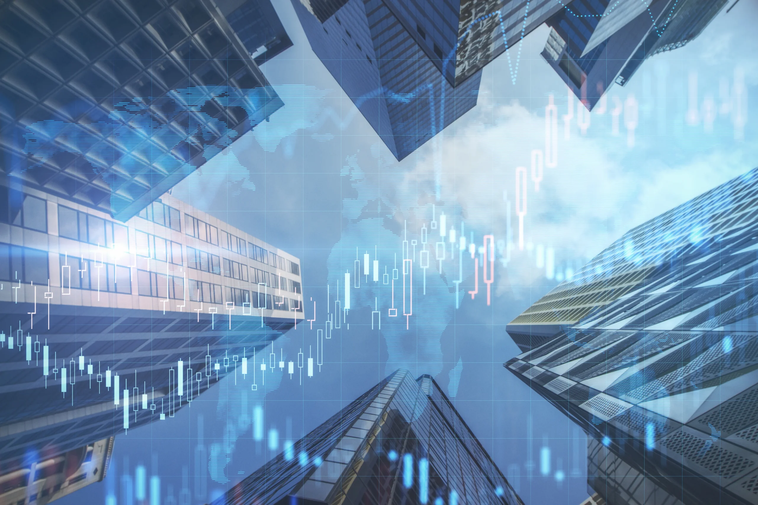 Low angle view of modern buildings with financial charts overlay