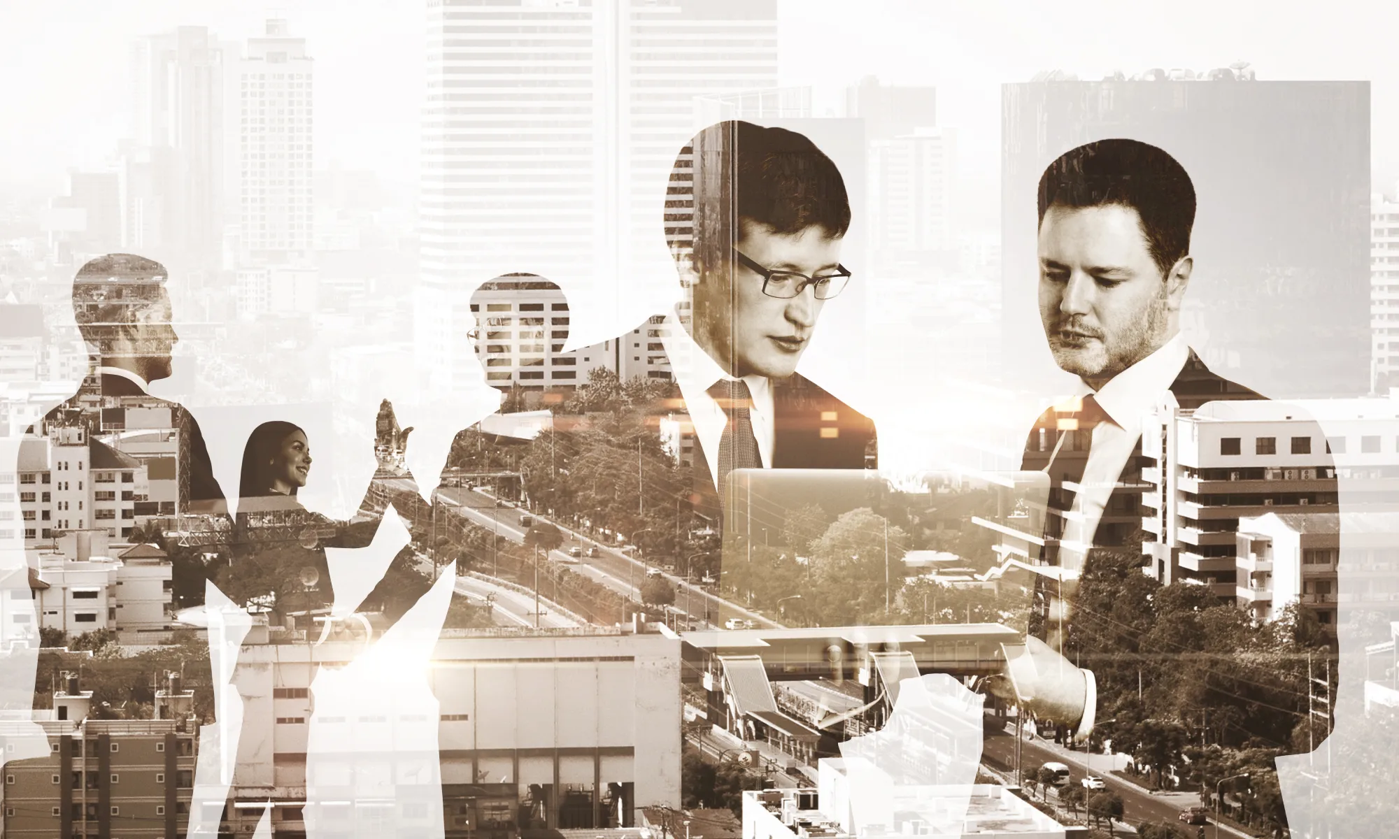 Double exposure of businesspeople over a city landscape
